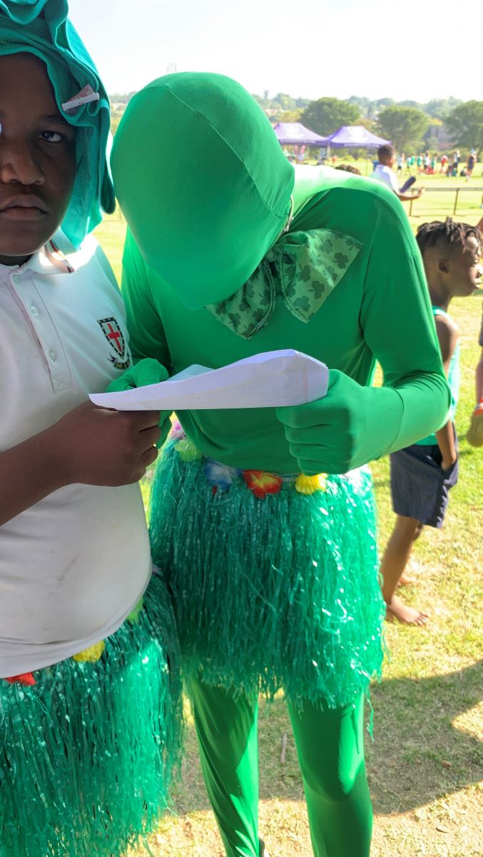 Green boy reading