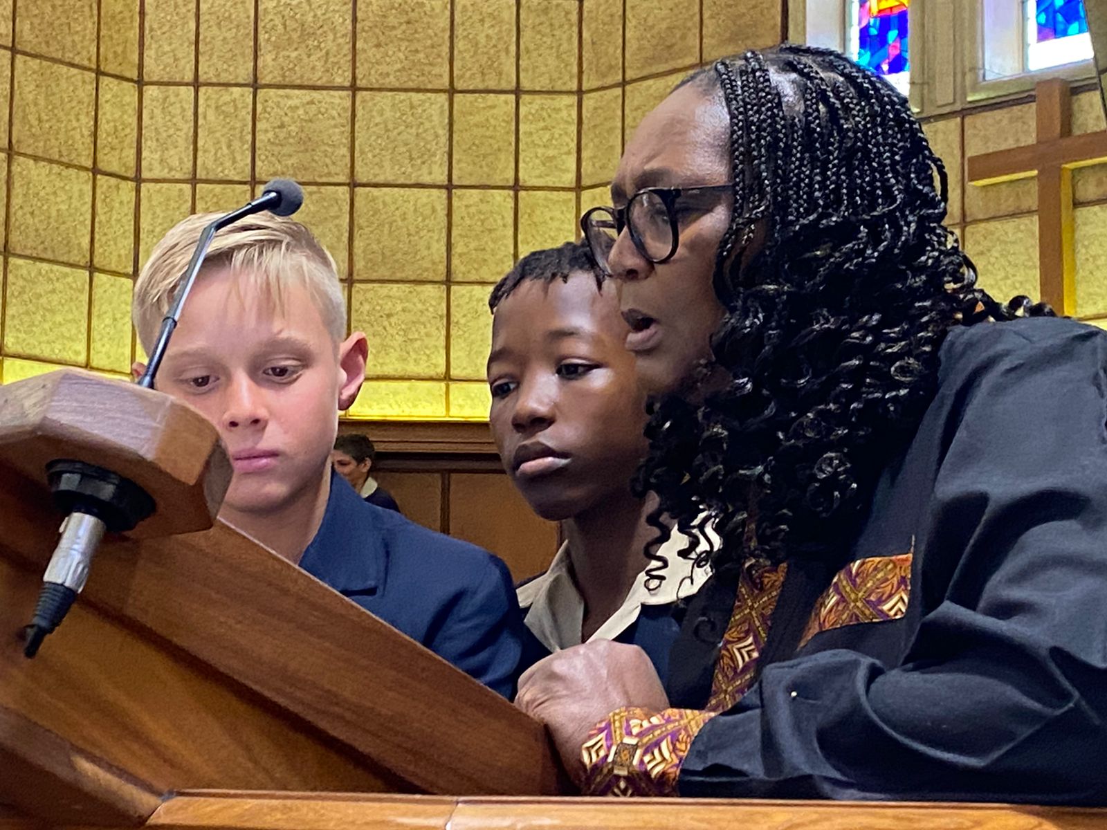Dix and chapel stewards at lectern